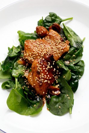 Honey and orange-glazed chicken thighs with sesame seeds