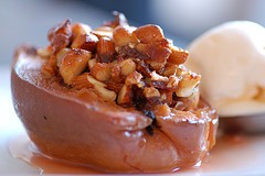 Honey baked quinces with macadamia & date stuffing and cinnamon icecream