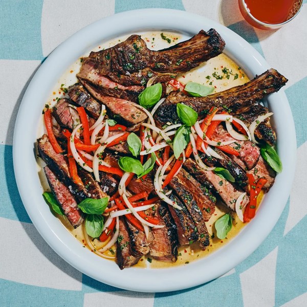 Honey-brushed steaks with peppers and onions 