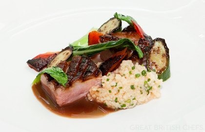 Honey-glazed duck breast, pak choi, baby courgette and tomato couscous