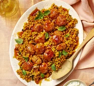 Honey-glazed meatballs with turmeric giant couscous