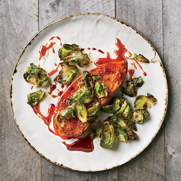 Honey-glazed sweet potato steaks with Brussels sprouts