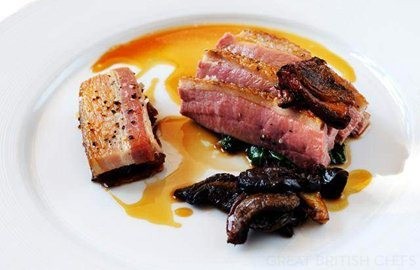 Honey-roasted breast of duck with smoked belly of pork, caramelised endive and ceps