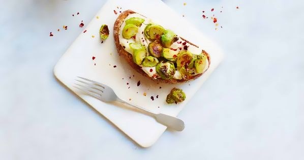 Honey-roasted sprouts with hummus on toast