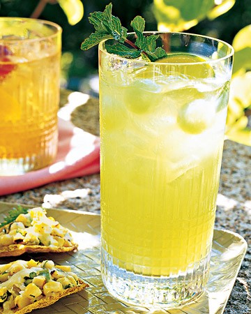 Honeydew mojitos with melon balls and mint