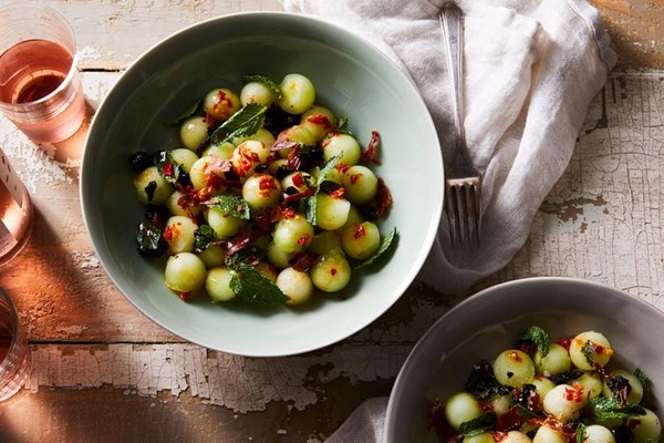 Honeydew with prosciutto, olives & mint