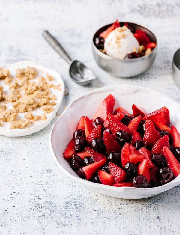 Honeyed strawberries and cherries with hazelnut and rosemary crumble