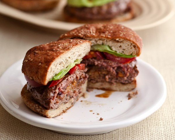 Horseradish, cheddar, and caramelized onion-stuffed burgers