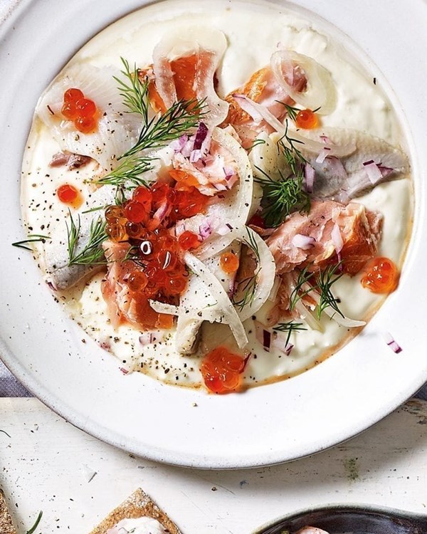 Horseradish sauce (Pepparrotssås) with pickled herring and hot-smoked salmon