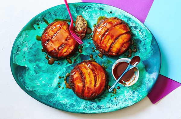 Hot banana, rum and raisin caramel puddings