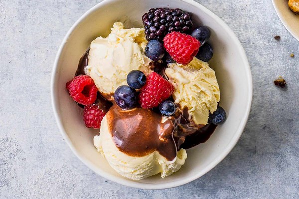 Hot chocolate and berry ice cream sundae