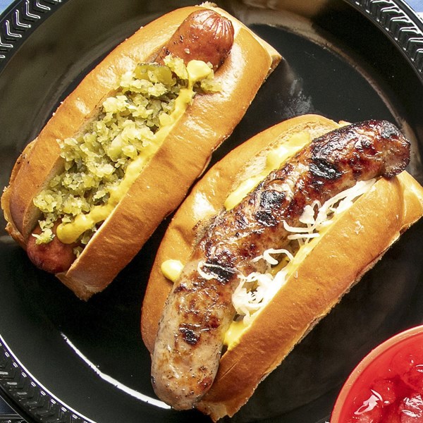 Hot dogs and bratwurst with sauerkraut and relish