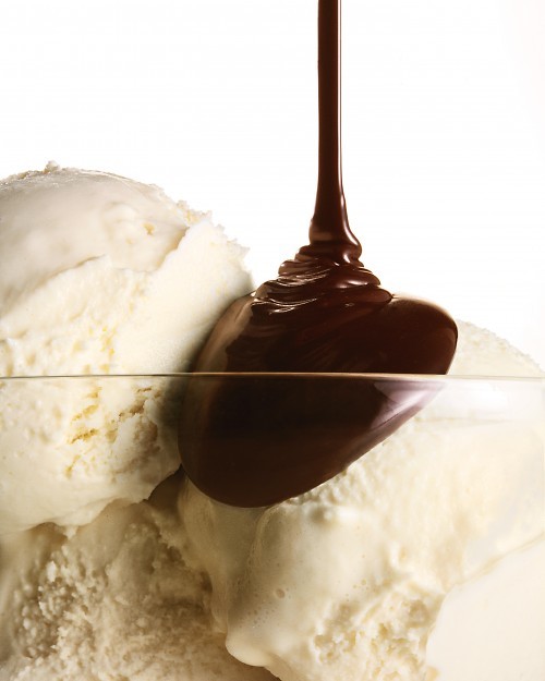 Hot fudge over vanilla ice cream