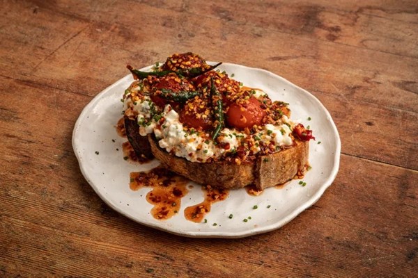 Hot honey cured egg yolks with chive cottage cheese on toasted sourdough
