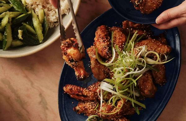 Hot honey gochujang & sesame chicken wings with smashed cucumbers