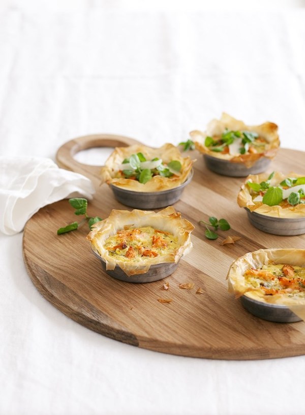 Hot smoked salmon filo tarts with a watercress and pecorino salad