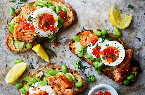 Hot smoked salmon with warm soft-boiled egg, soured cream & broad beans 