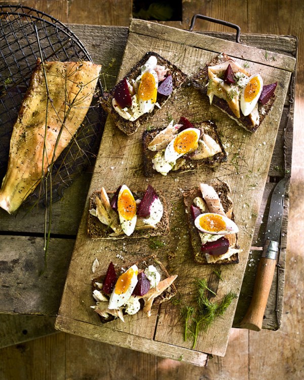 Hot-smoked trout on rye toasts with beets, soft-boiled eggs and mustard & dill sauce