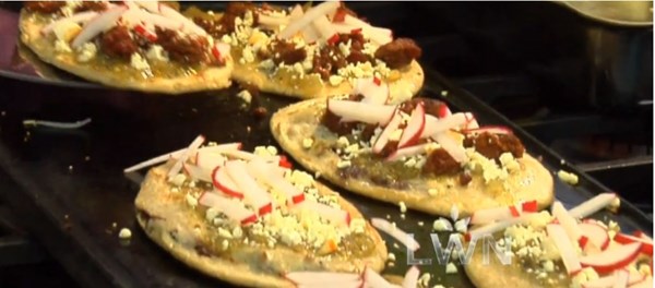 Huaraches with tomatillo salsa and chorizo