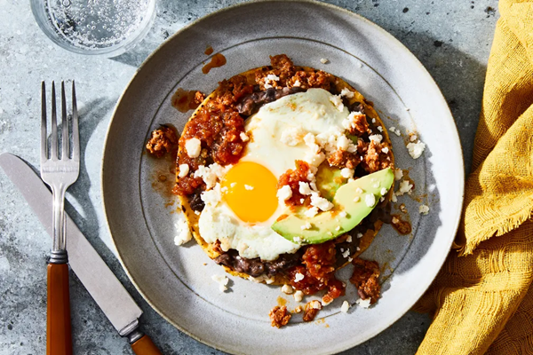 Huevos rancheros with chorizo & porky refried beans