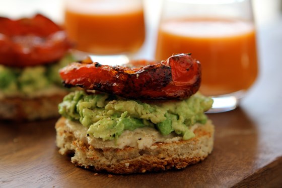 Hummus and avocado toasts with roasted tomatoes