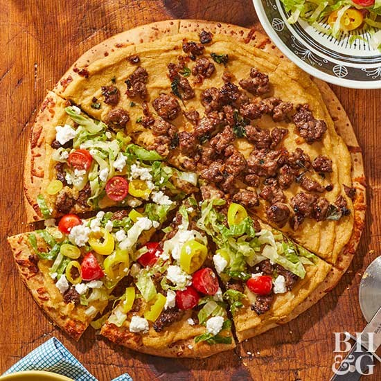 Hummus and lamb pizza with romaine