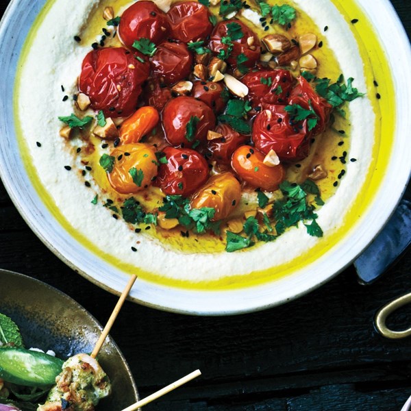 Hummus with roasted tomatoes and almonds