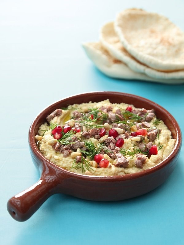 Hummus with seared lamb and toasted pinenuts
