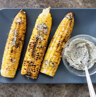 Husk-grilled corn with brown sugar-cayenne butter