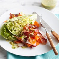 Iceberg wedge salad with bacon, carrots, and radishes