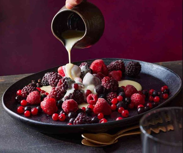 Iced berries with hot limoncello sauce