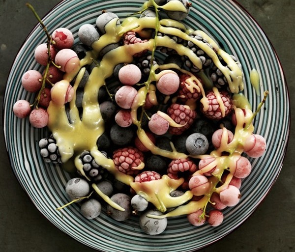 Iced berries with hot white chocolate sauce