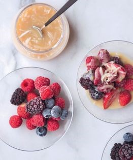 Iced berries with hot white chocolate sauce