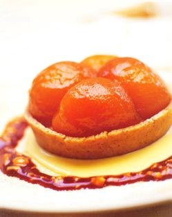 Iced pear parfait with caramelized pears in a hazelnut tart