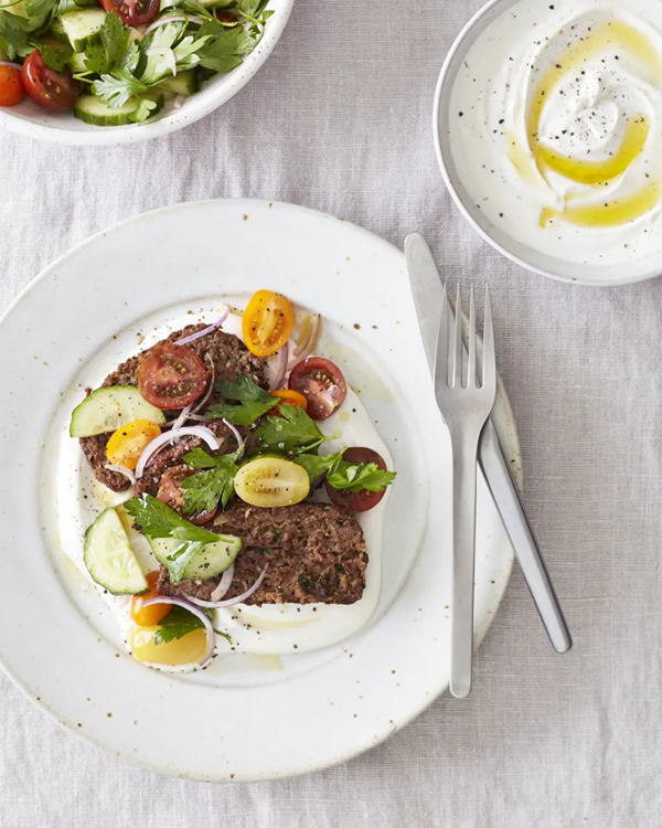 Impossible kofta meatloaf with spiced yogurt and tomato-cucumber salad