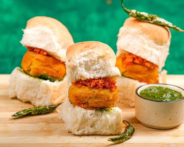 Indian deep-fried potato balls on rolls (Vada pav)