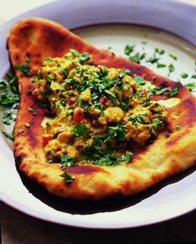 Indian scrambled eggs over hot naan