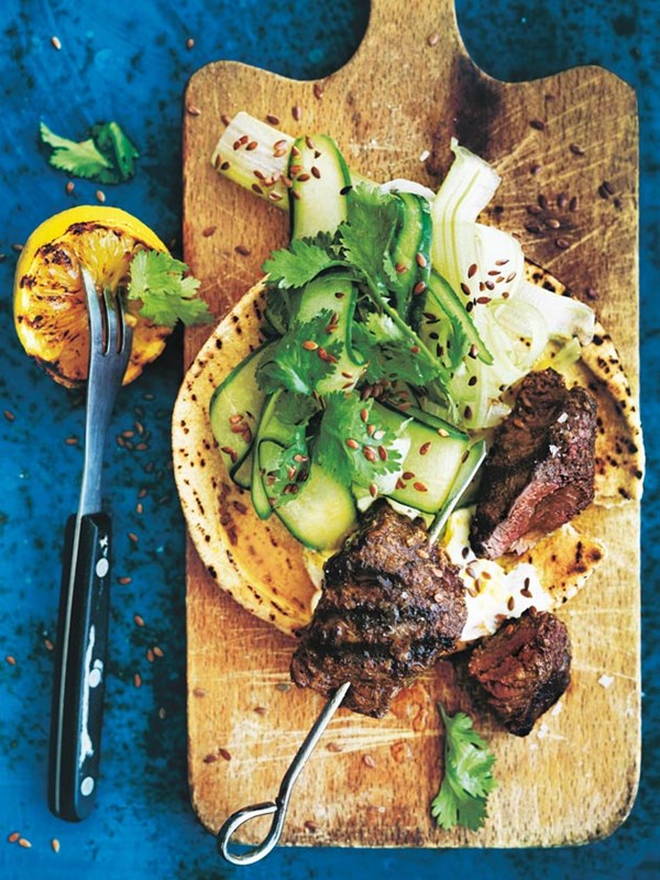 Indian-spiced beef skewers with celery slaw