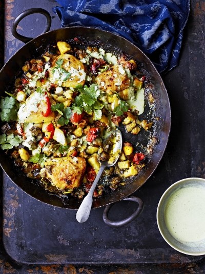 Indian-spiced potatoes with chicken thighs