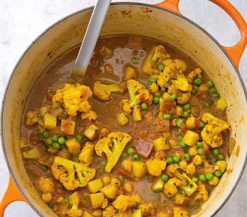 Indian-style curry with potatoes, cauliflower, peas, and chickpeas