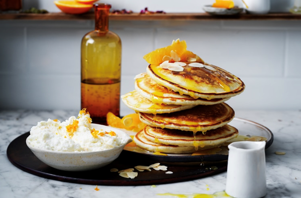 Indian-style fennel seed pancakes with whipped ricotta and oranges