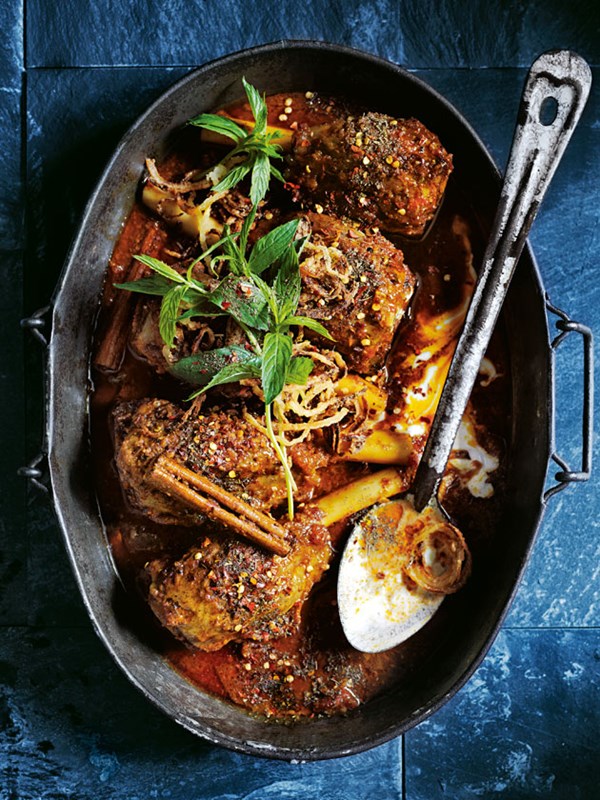 Indian-style slow-cooked lamb shanks with crispy onions
