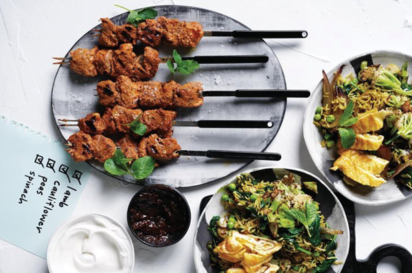 Indian vegetable fried rice with tandoori lamb skewers