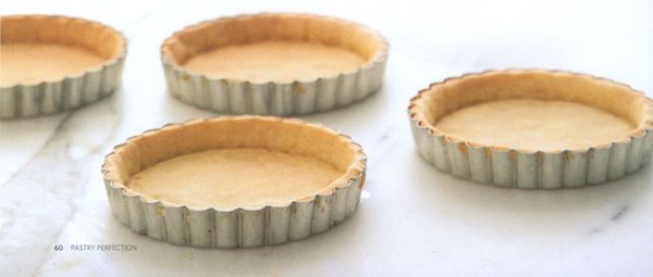 Individual raspberry & pistachio tarts