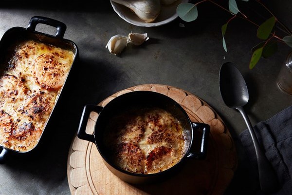 Individual sweet potato gratins with creme fraiche, onions, and bacon