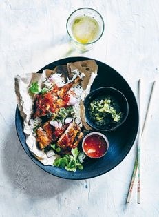 Indonesian grilled chicken legs with green and red sambals