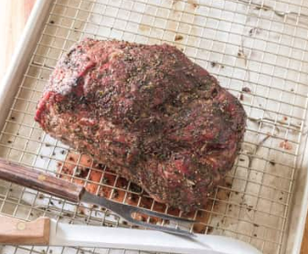 Inexpensive grill-roasted beef with garlic and rosemary