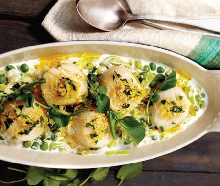 Irish butter-poached scallops with leeks and sweet garden peas