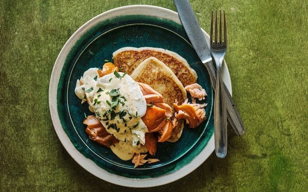 Irish potato bread with hot-smoked salmon, poached egg and herb cream sauce