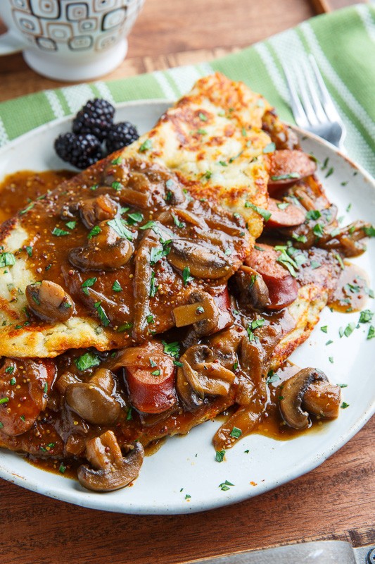 Irish potato pancakes (boxty) with bangers in a Guinness mushroom and onion gravy